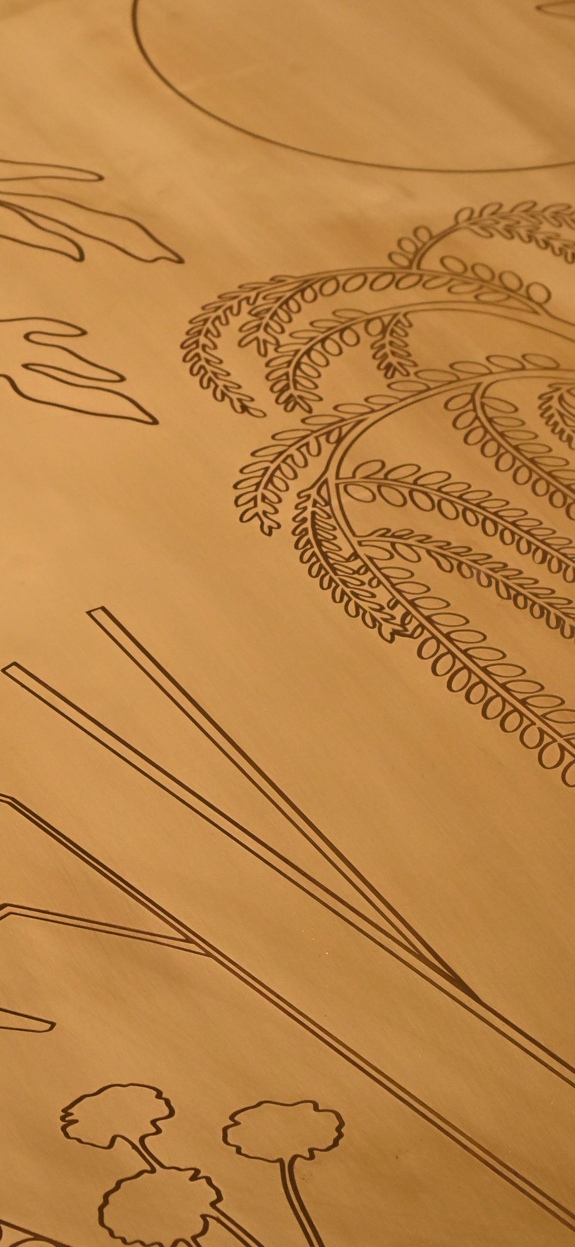 Engraved brass surface of the Sun’s Grace table